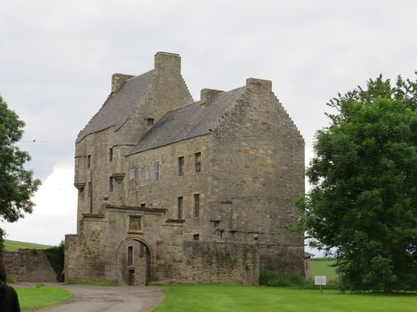 From Glasgow: Outlander Adventure Tour with Tickets - Blackness Castle ramparts and the ship that never sailed