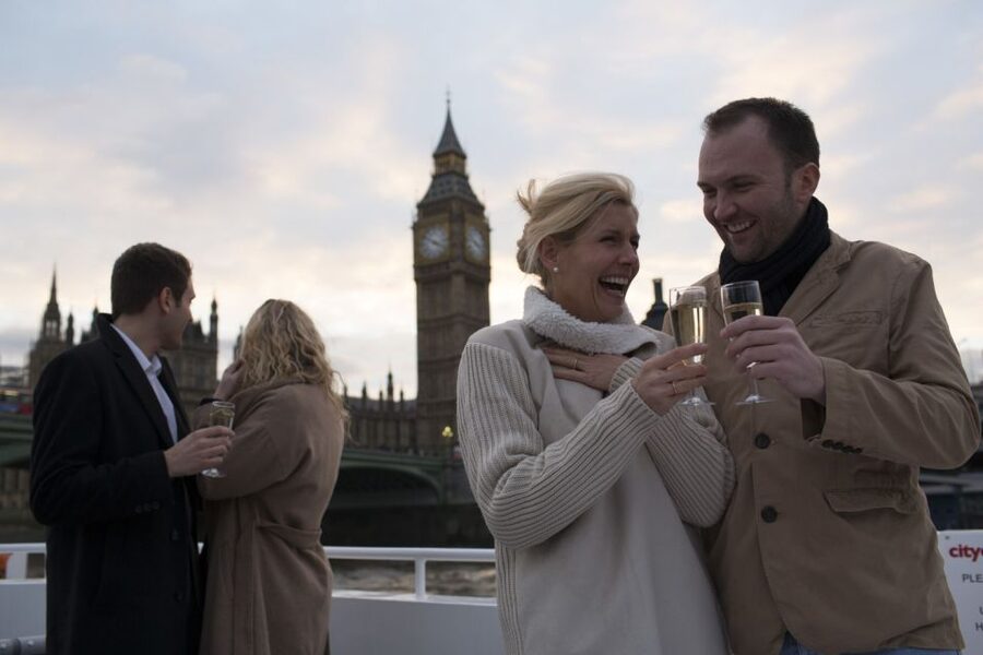 London: River Thames Evening Cruise with Bubbly and Canapés - Sunset lighting on London’s landmarks: London Eye to Parliament, with Tower Bridge in between
